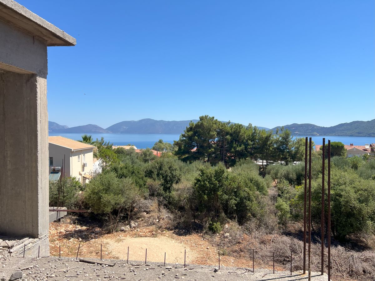 Semi-detached shell for sale in Karavomilos with sea view
